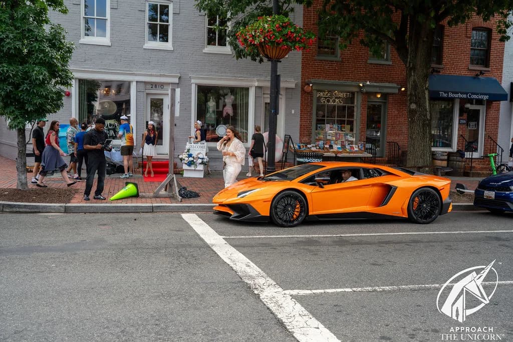 Orange Lamborghini outside Acqua Pura Boutique in Georgetown