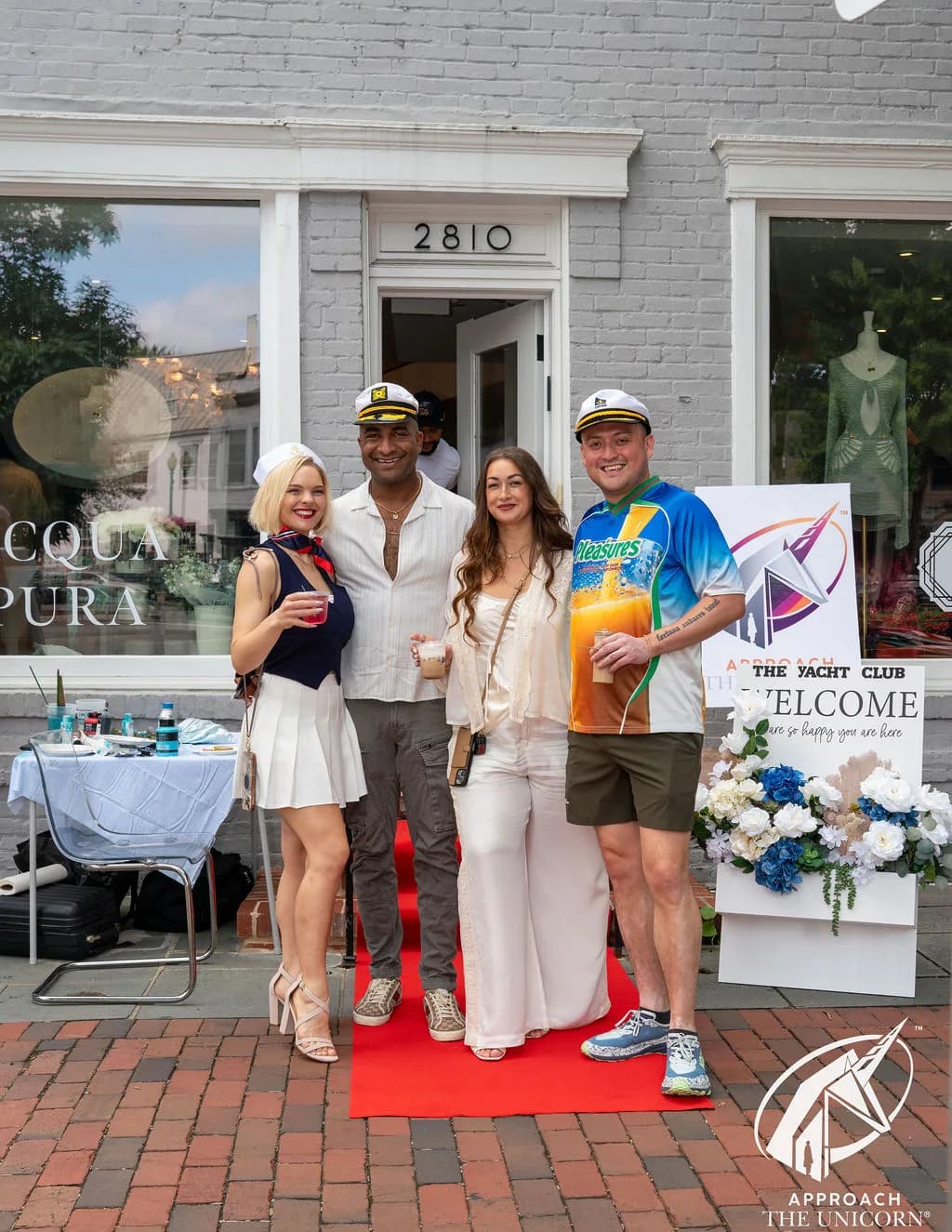 Guests on the red carpet outside Acqua Pura Boutique at 2810 Pennsylvania Avenue